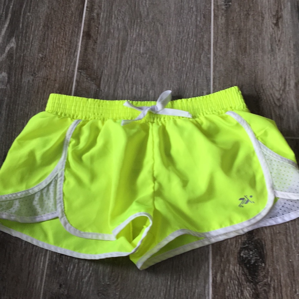 Two pairs of neon yellow shorts for summer fun!